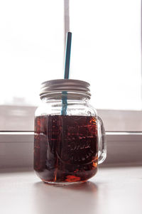 Close-up of glass of jar on table