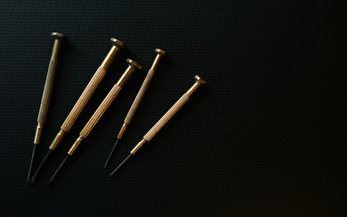 High angle view of painting on table against black background