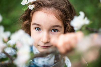 Portrait of girl by flowers