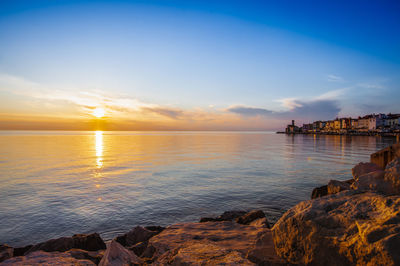 Scenic view of sea against sky during sunset