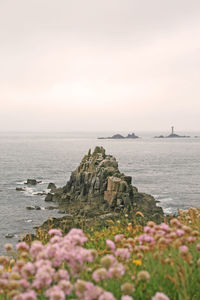 Scenic view of sea and rocks against sky