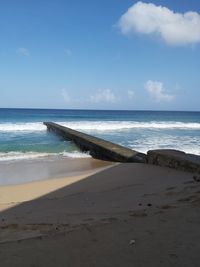 Scenic view of beach against sky