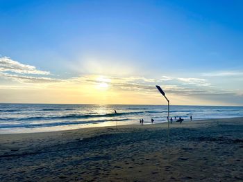 Scenic view of beach against sky during sunset