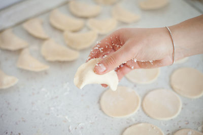 Midsection of woman preparing food