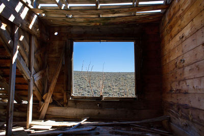 Abandoned building seen through window