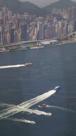 High angle view of sea and buildings in city