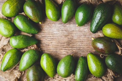 High angle view of avocadoes on burlap