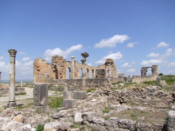 Ruins of historical building against cloudy sky