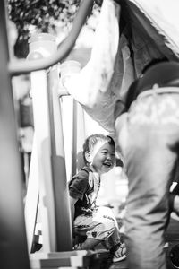 Rear view of two people on the floor