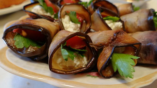 Close-up of eggplant rolls on plate