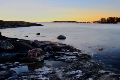 Scenic view of sea against sky during sunset