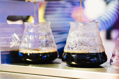 Coffee being poured into jar