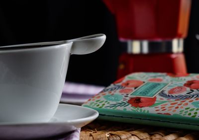 Close-up of coffee cup on table