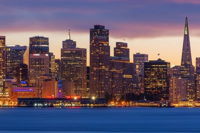 Illuminated city at dusk