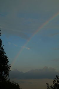 Low angle view of rainbow against sky
