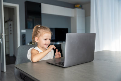 Boy using laptop at home