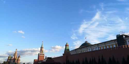 Low angle view of buildings against blue sky