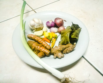 High angle view of fruits in plate on table