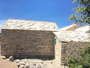 Brick wall against clear sky
