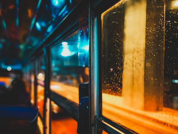 Close-up of illuminated glass window at night