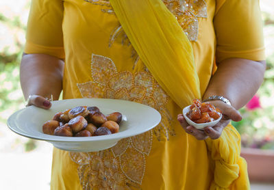 Woman holding plate