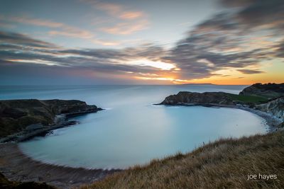 Scenic view of sea against sky at sunset