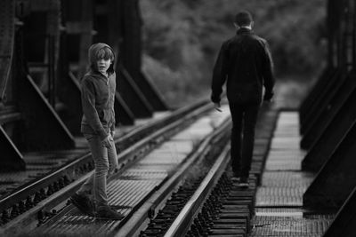 Brothers on railroad track