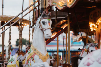 Close-up of amusement park ride at night