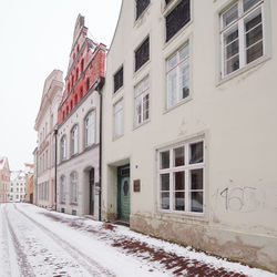 Houses against clear sky during winter