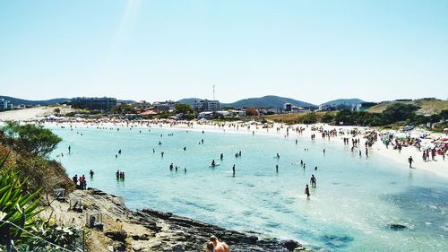 Scenic view of beach against blue sky