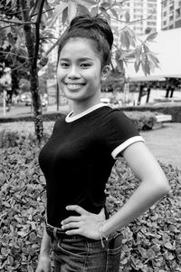 Portrait of teenage girl standing on land