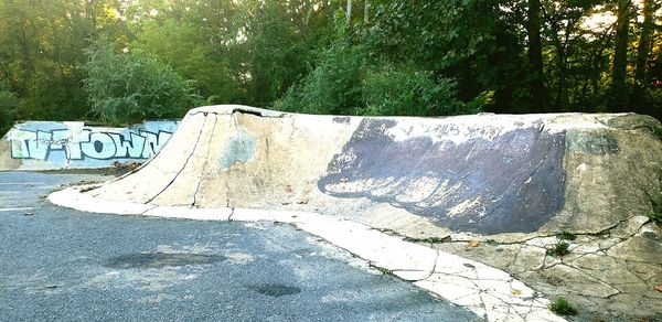 Text on retaining wall in park