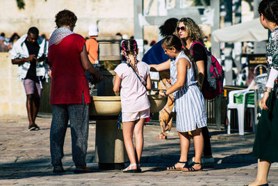 Group of people walking in city