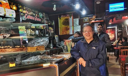 Portrait of a smiling man standing in store