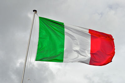 Low angle view of flag against sky