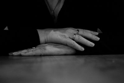 Close-up of woman hand on table