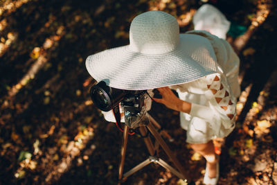 High angle view of woman wearing hat on field