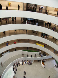 High angle view of people walking in modern office