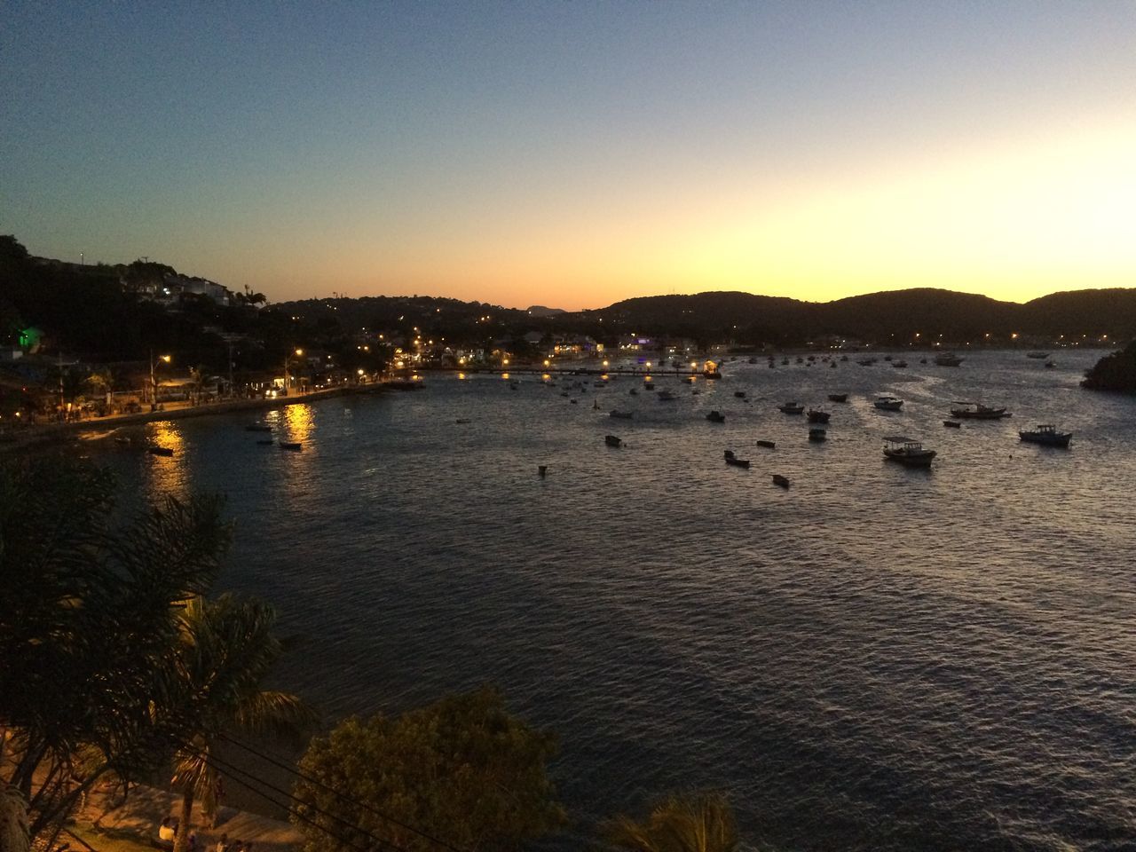 VIEW OF CALM SEA AGAINST SKY DURING SUNSET