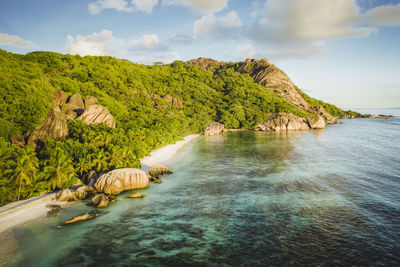 Golden sunset vibe colors at anse source d argent exotic beach at seychelles. aerial