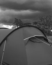 View of tent against cloudy sky
