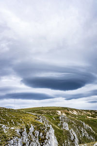 Low angle view of land against sky