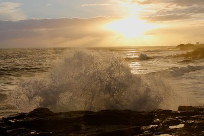 Scenic view of sea against sky during sunset