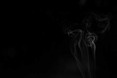 Close-up of smoke against black background