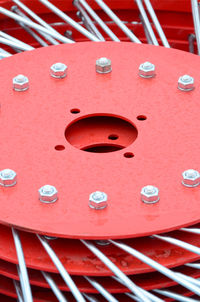 High angle view of red wheels stacked outdoors