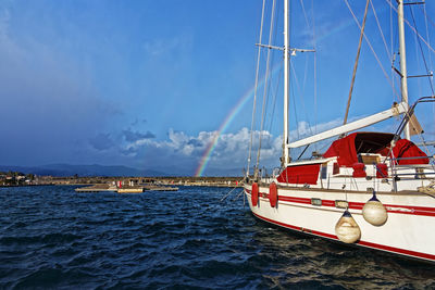 Sailboat sailing on sea against sky