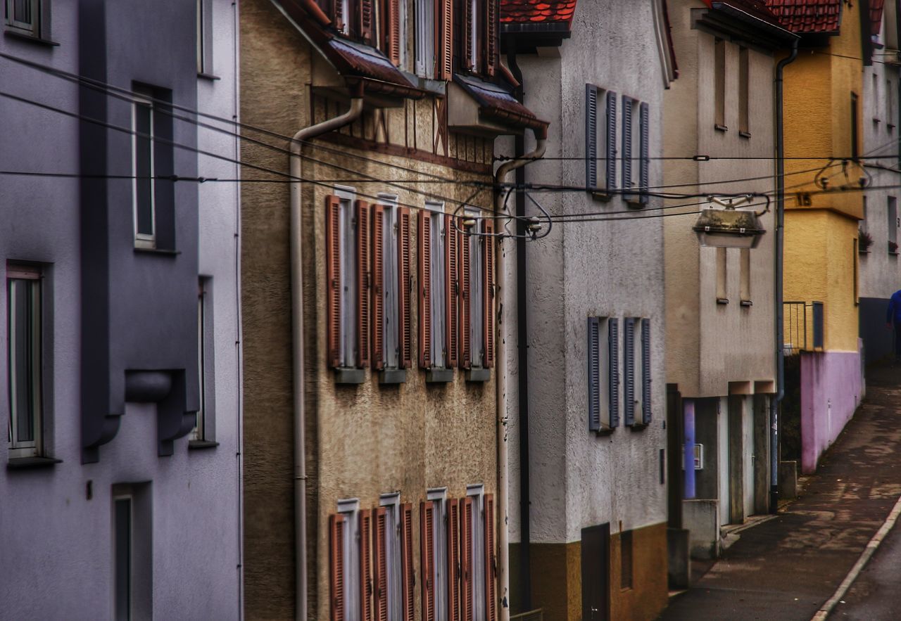 hanging, in a row, no people, indoors, built structure, architecture, air conditioner, day
