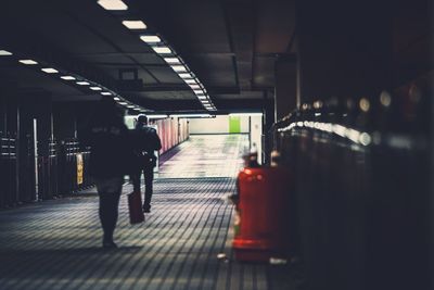 Rear view of man at subway station