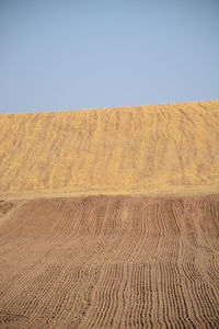 Scenic view of desert against clear sky