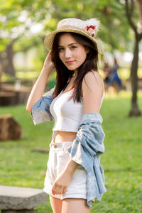 Portrait of beautiful young woman standing outdoors